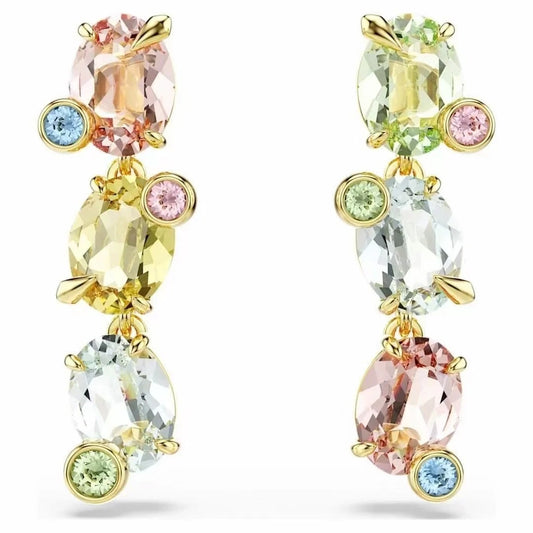 Colorful gemstone earrings with gold accents on a white background