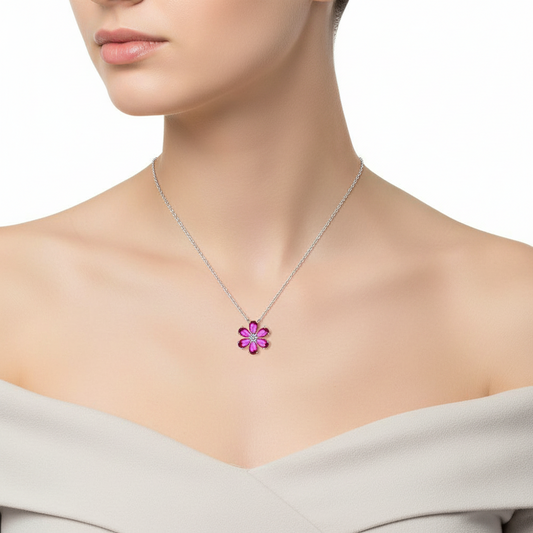 Pink flower-shaped pendant necklace on a white background